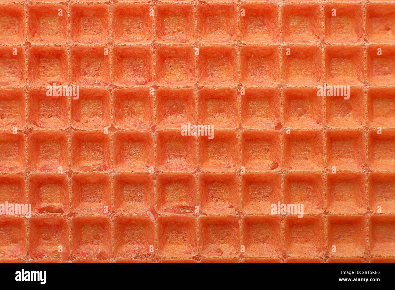 Red waffles surface closeup detail background Stock Photo