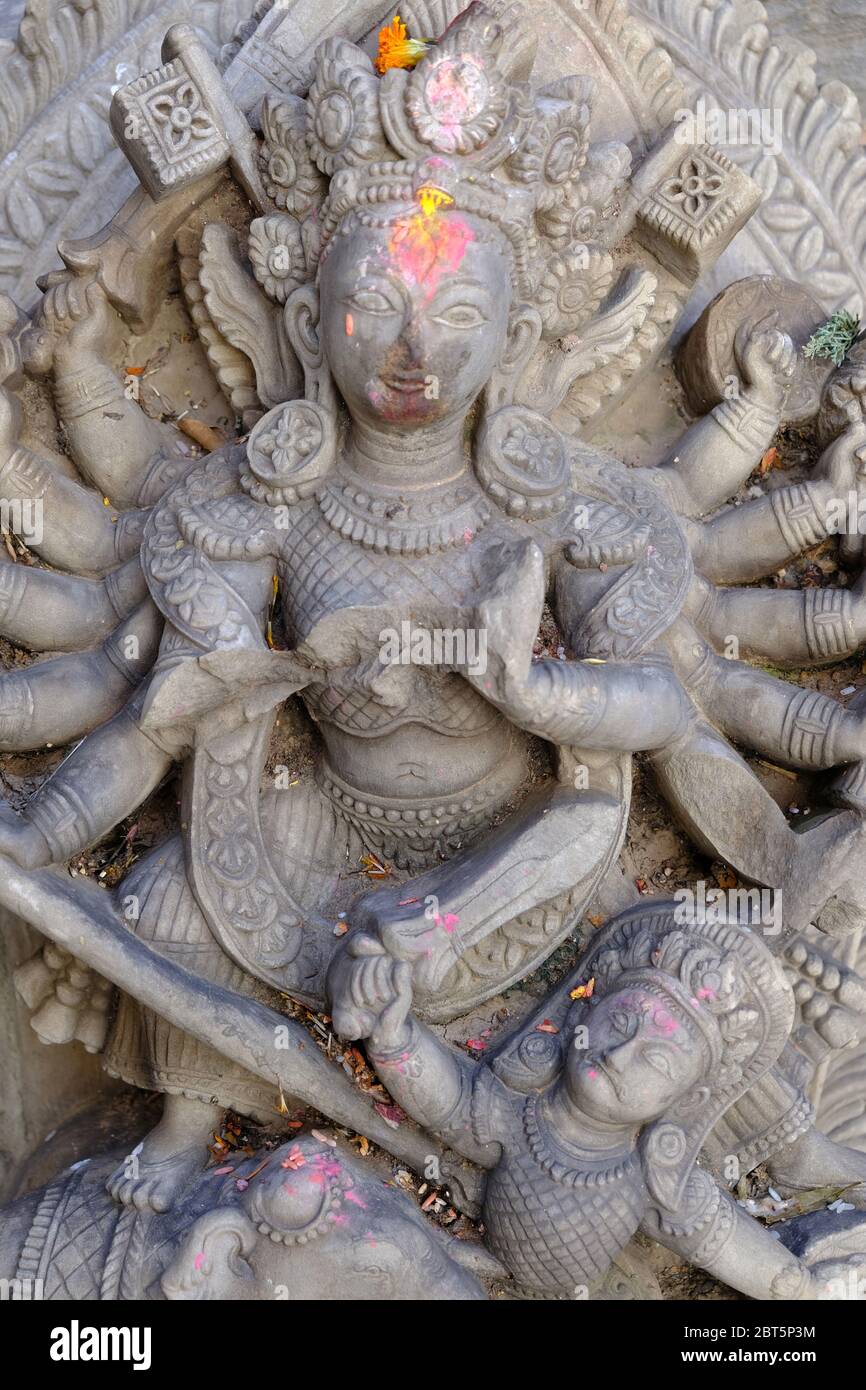Bhaktapur Nepal - artful wood carving of Ugrachandi image and sacrifices to Shiva Stock Photo