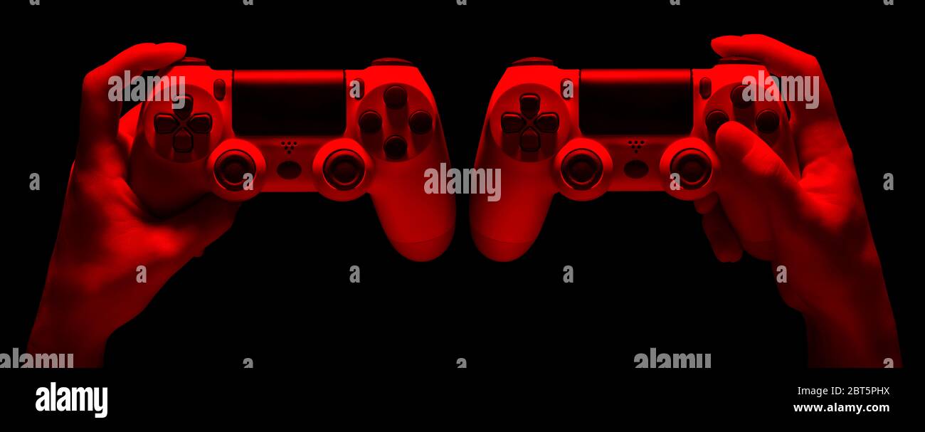 Set of hands holding video game gamepad in neon lights isolated on a ...