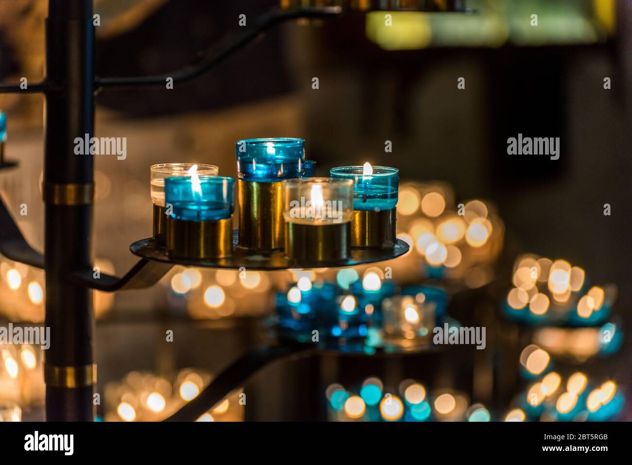Burning candles in the Basilica of the Sacred Heart of Paris, France