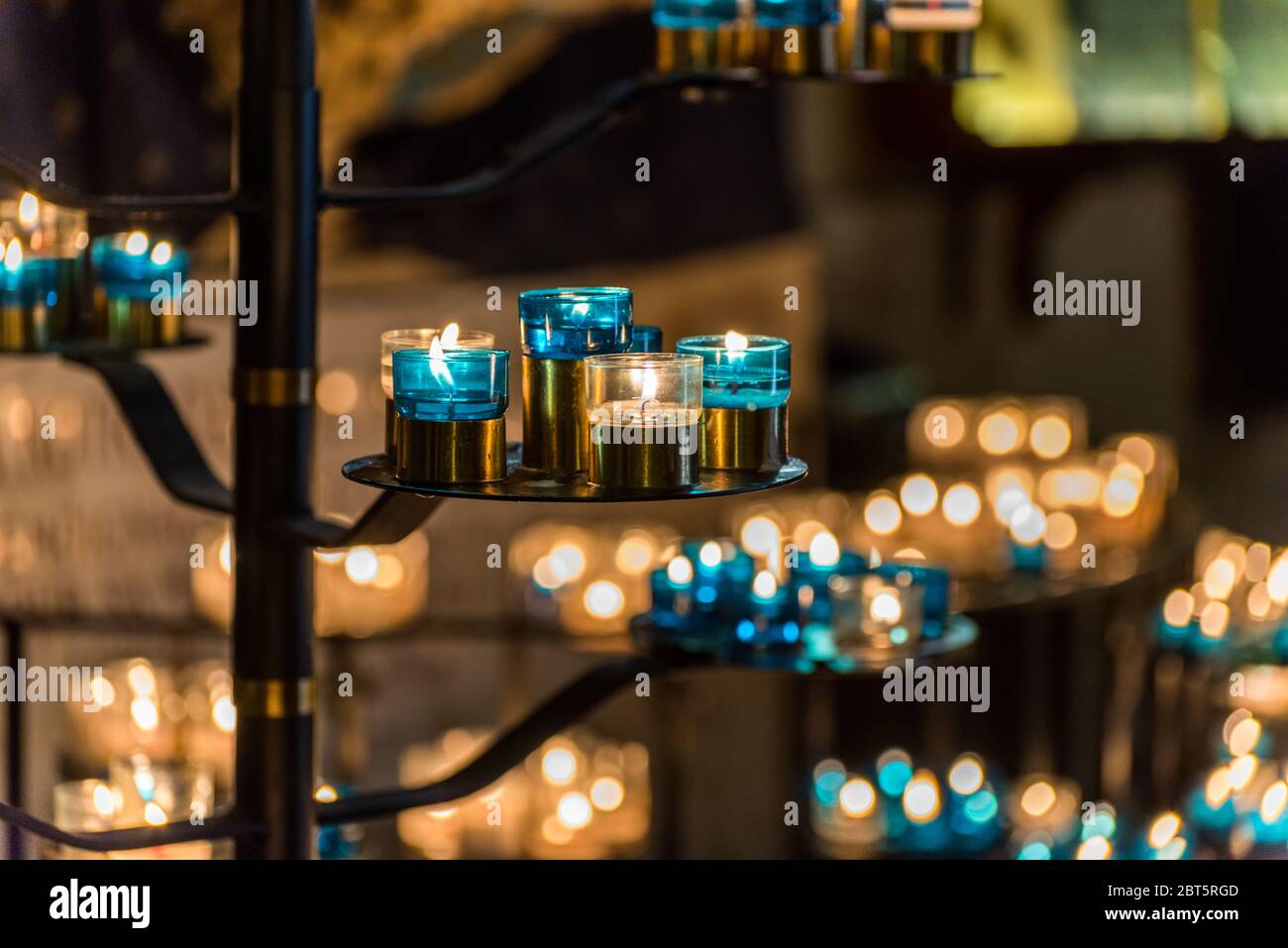 Burning candles in the Basilica of the Sacred Heart of Paris, France