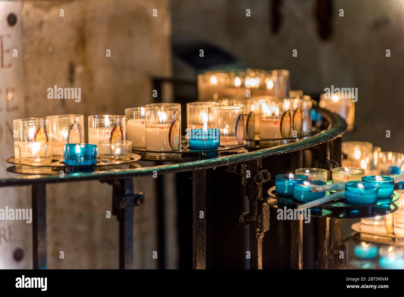 Burning candles in the Basilica of the Sacred Heart of Paris, France