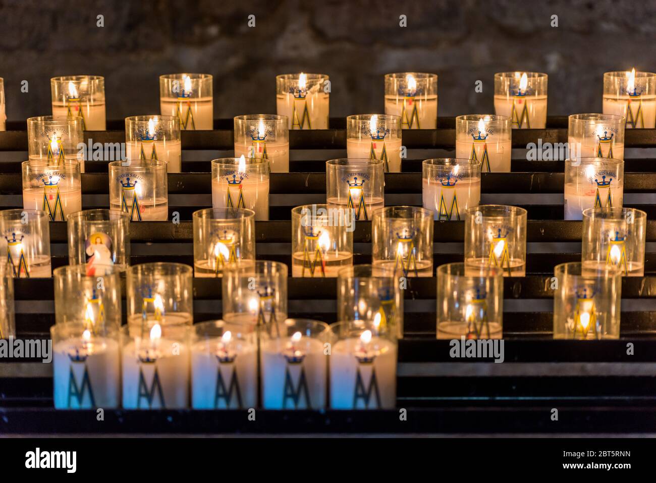Burning candles in the Basilica of the Sacred Heart of Paris, France