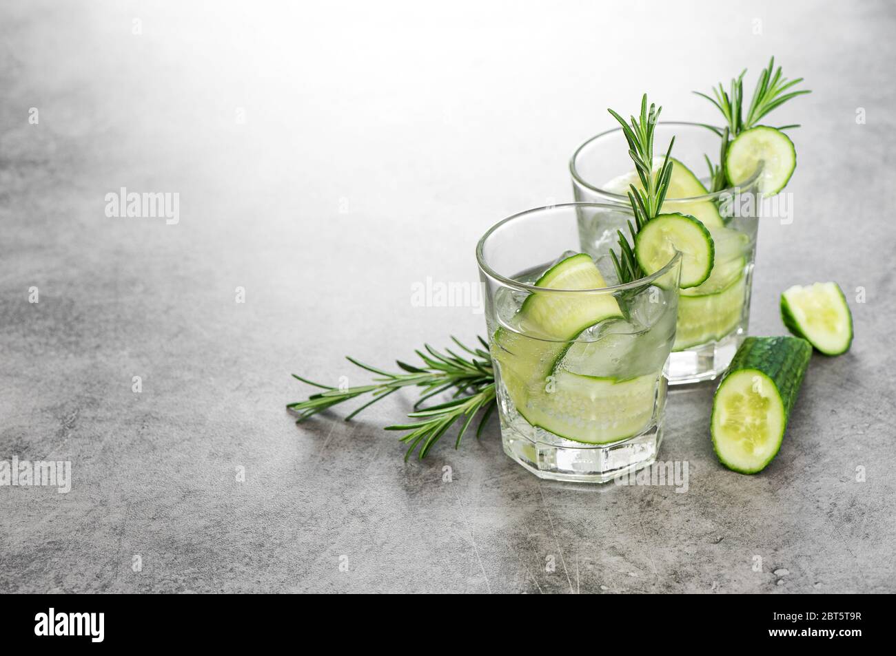 Fresh drink with cucumber and rosemary herb. Cold summer beverage Stock