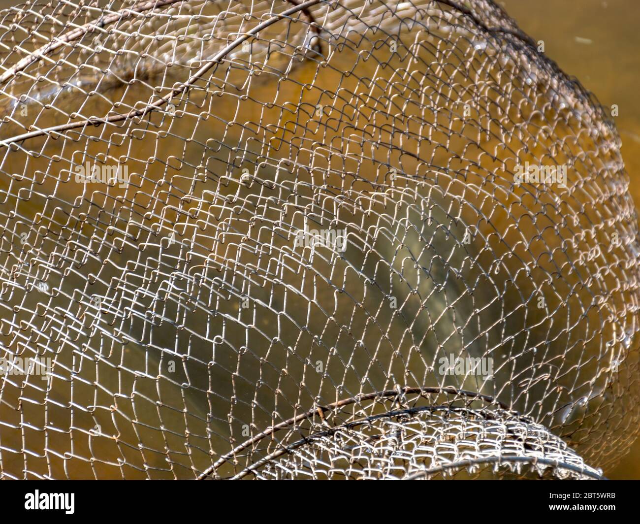 picture with fish net in the water, fishing as a leisure concept, water ...