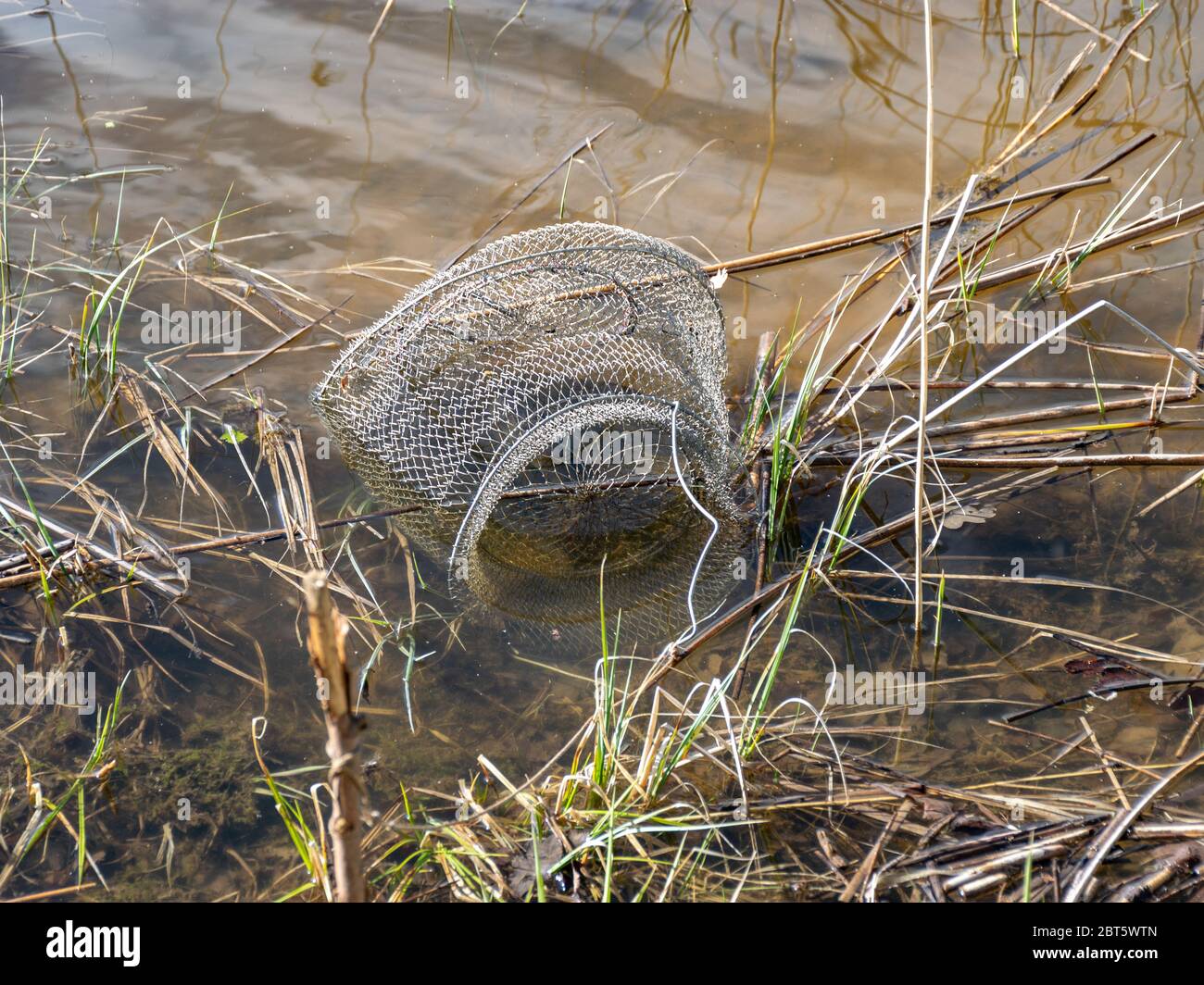 picture with fish net in the water, fishing as a leisure concept, water ...