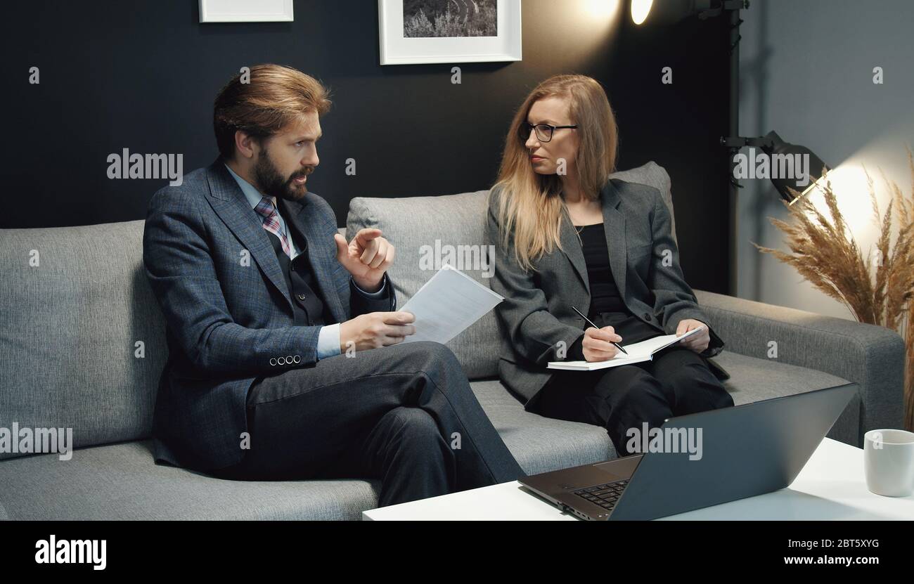 Two business people discussing ideas Stock Photo