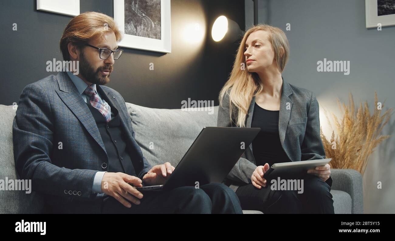 Two business people discussing ideas Stock Photo