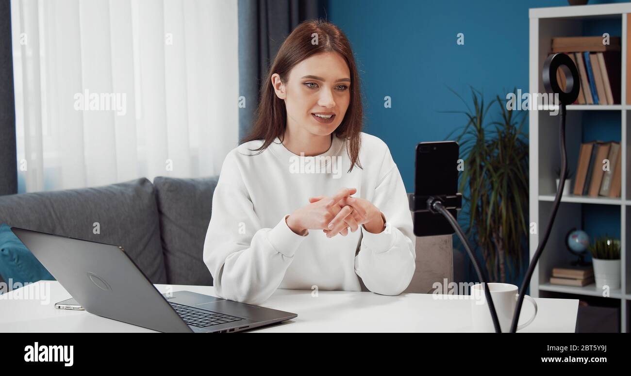 Female vlogger recording video Stock Photo
