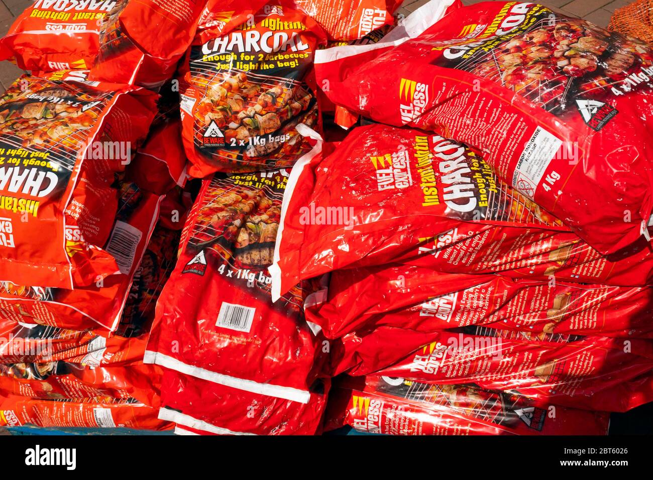 A stack of Instant Lighting charcoal briquettes for barbecue fuel in a