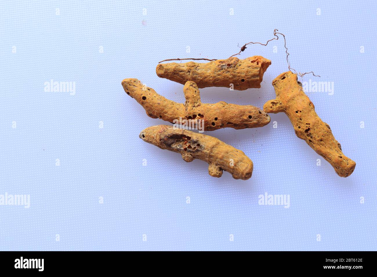 Fresh Dried Turmeric root isolated on a white background Stock Photo