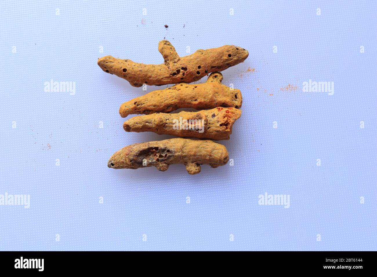 Fresh Dried Turmeric root isolated on a white background Stock Photo