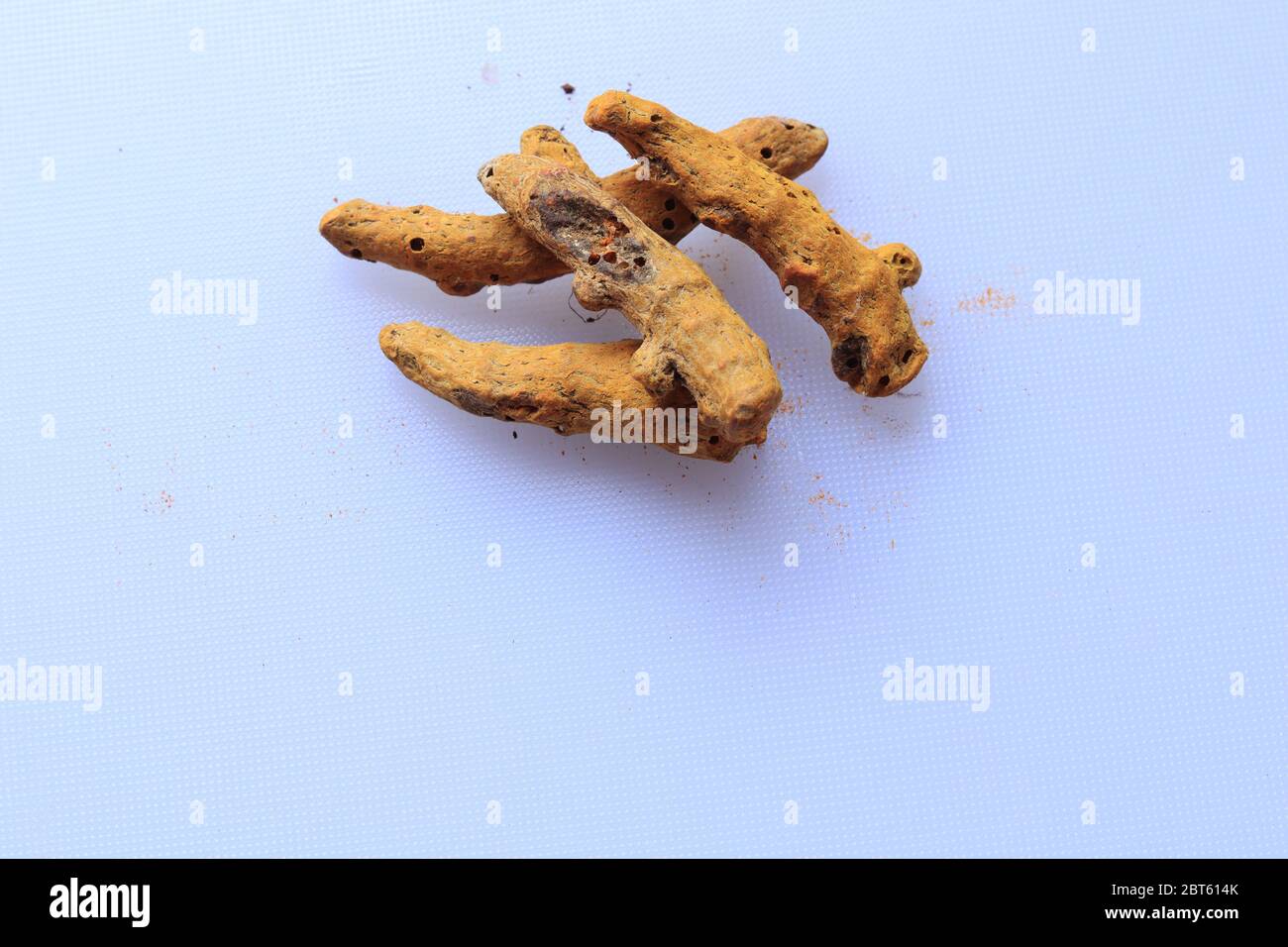 Fresh Dried Turmeric root isolated on a white background Stock Photo