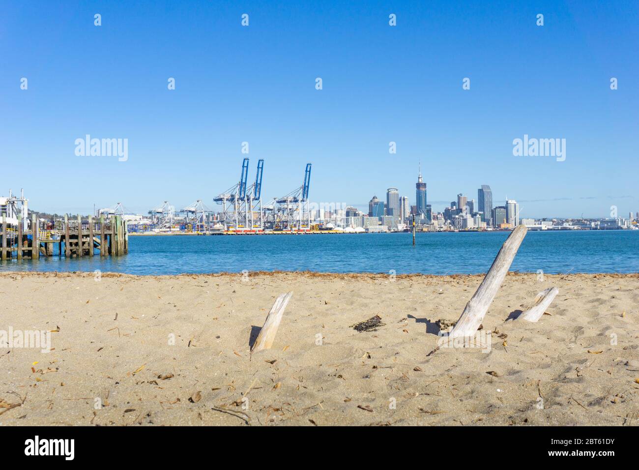 Auckland, New Zealand - May 22 2020; View across Auckland harbour from beach beside Devonport wharf. Stock Photo