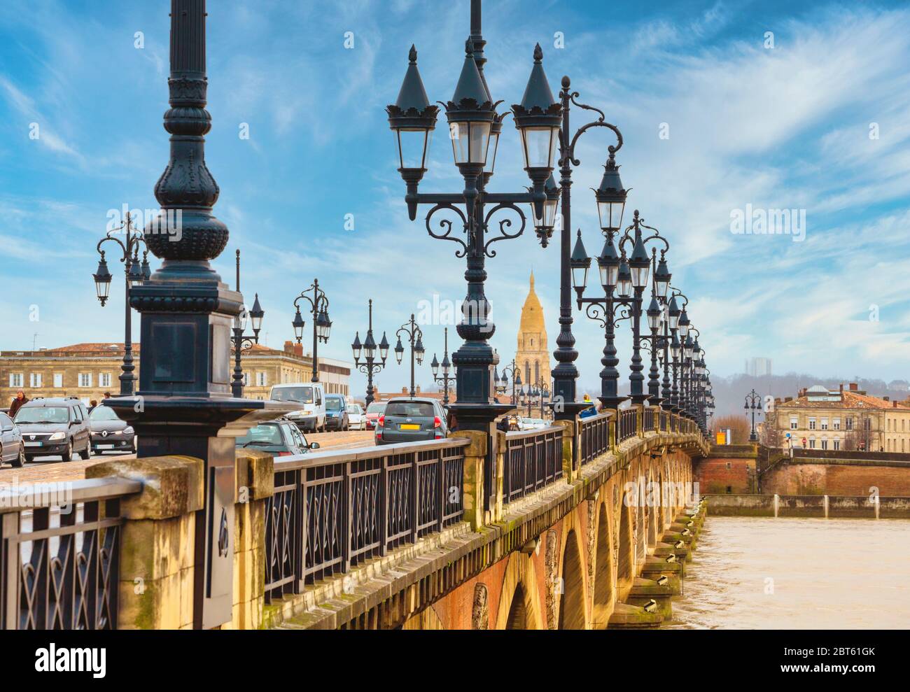 Bordeaux, Gironde Department, Aquitaine, France.  Pont de Pierre or the Stone Bridge, built between 1819 and 1822. The spire belongs to the church of Stock Photo