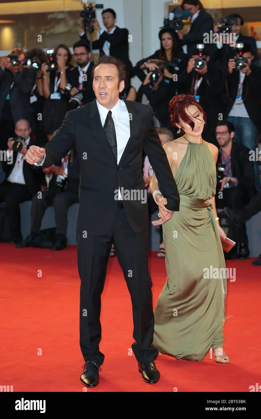 VENICE, ITALY - AUGUST 30: Nicolas Cage and Alice Kim Cage attend the 'Joe' Premiere during The 70th Venice Film Festival on August 30, 2013 in Venice Stock Photo