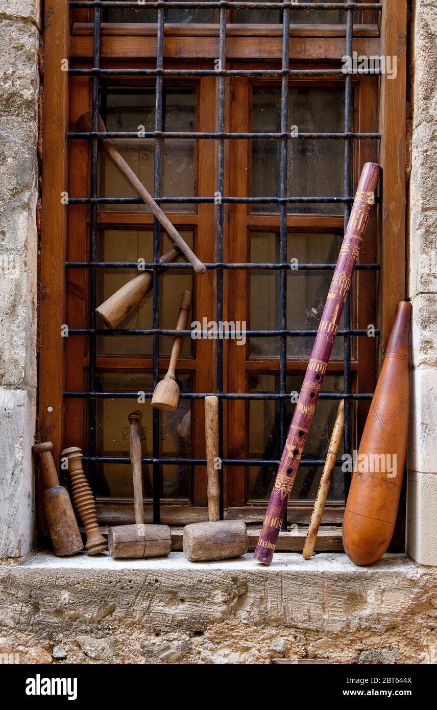 Mallets and flute in a window, Chania, Crete, Greece Stock Photo Alamy