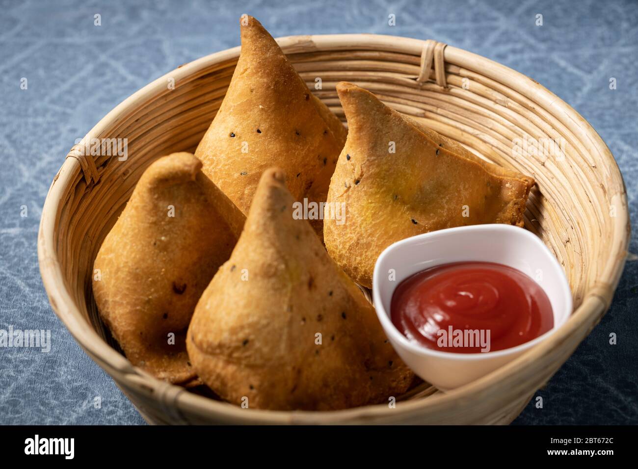 Punjabi Samosa, a snack filled with mashed potato deep fried a tasty snack preferred by most indians Stock Photo