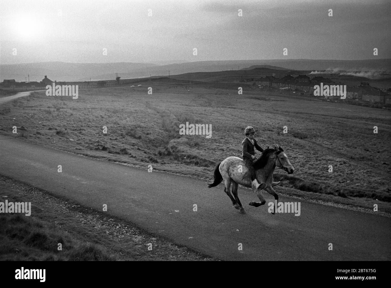 Boy riding bareback on a Welsh mountain pony, Hilltop, Ebbw Vale, South