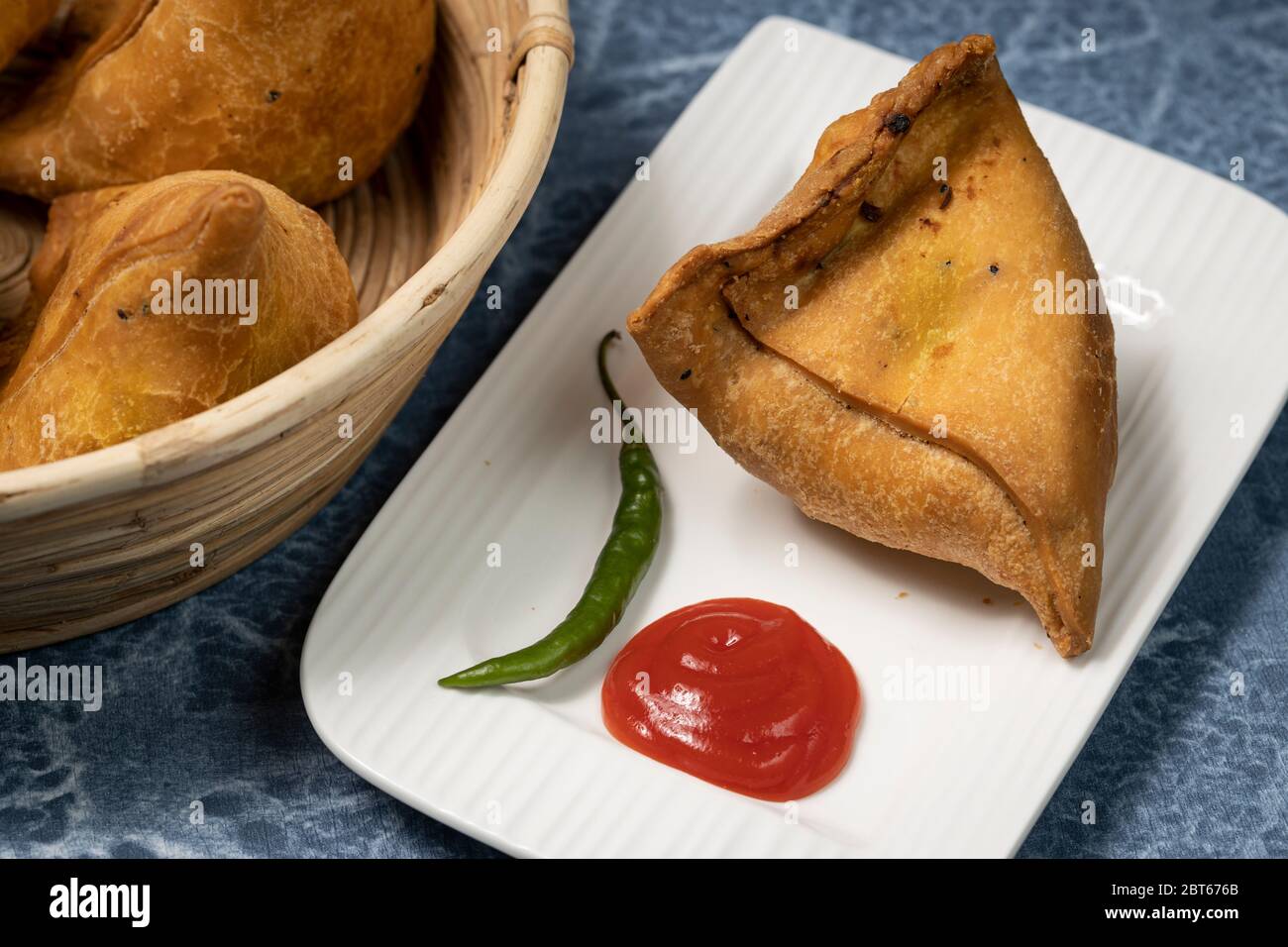 Punjabi Samosa, a snack filled with mashed potato deep fried a tasty snack preferred by most indians Stock Photo
