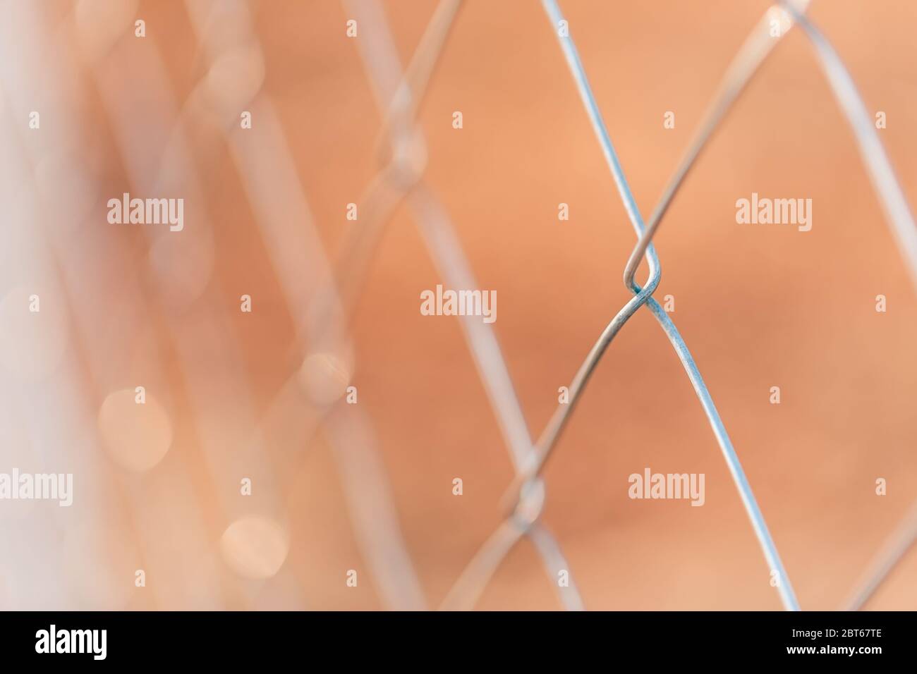 Barbed wire fence with blurred background of the Stock Photo - Alamy