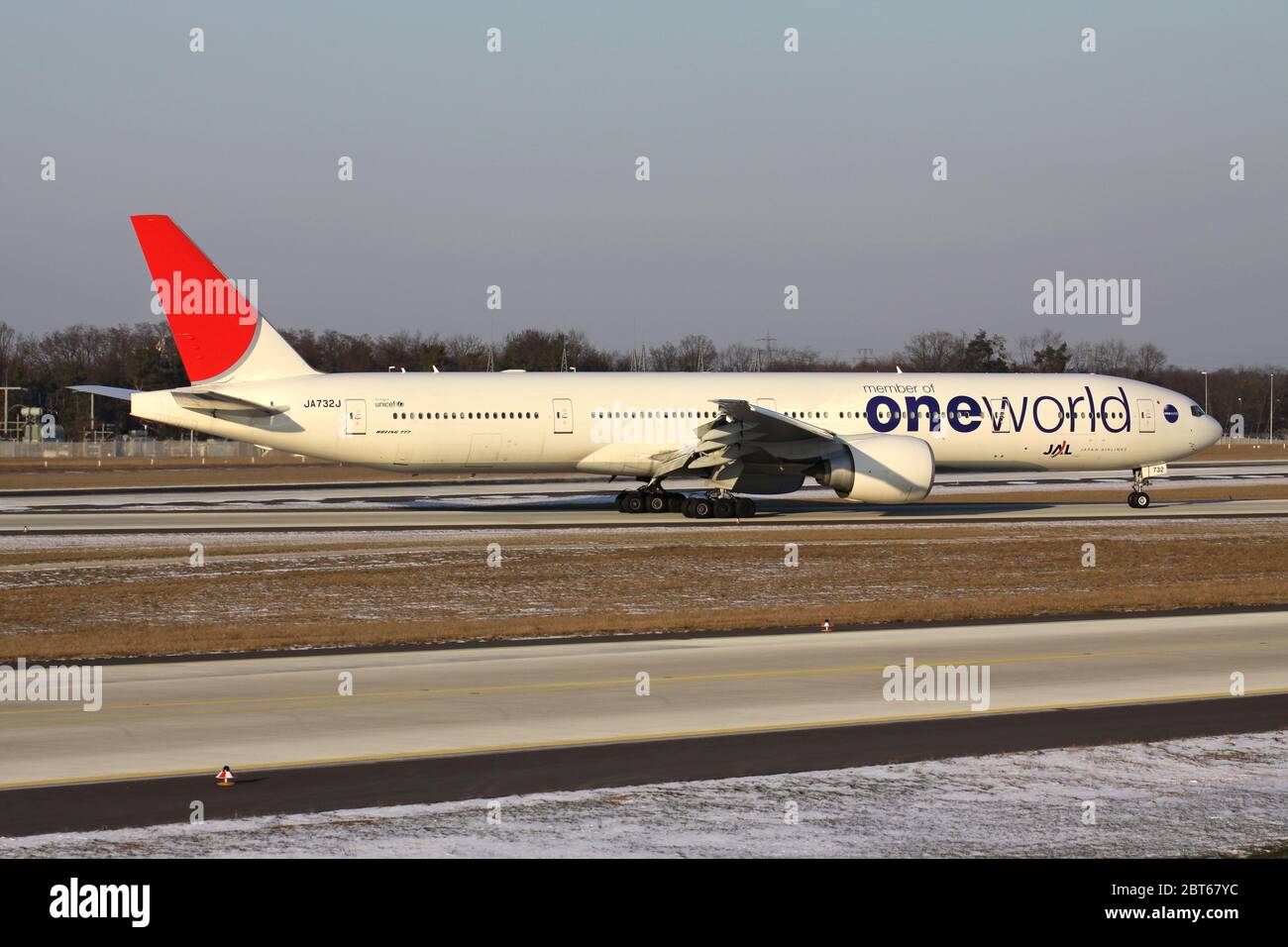 JAL Japan Airlines Boeing 777-300 in special oneworld livery with registration JA732J just landed on runway 07L of of Frankfurt Airport. Stock Photo