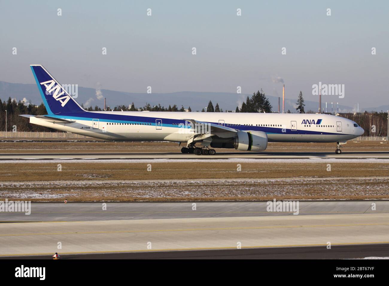 Japanese ANA Boeing 777-300 with registration JA734A just landed on runway 07L of of Frankfurt Airport. Stock Photo