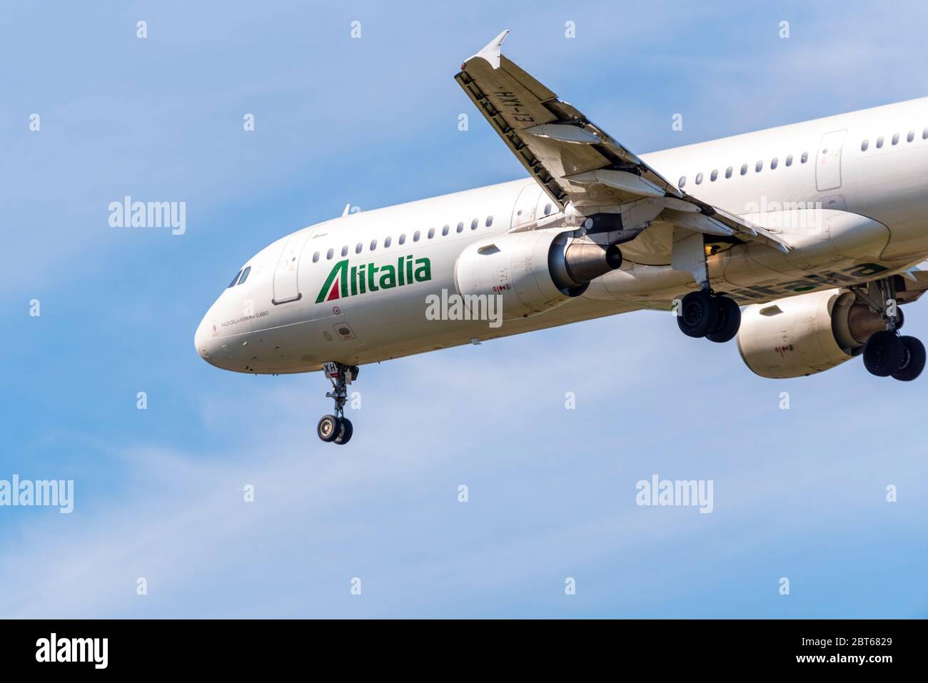 Alitalia Airbus A321 jet airliner plane landing at London Heathrow Airport over Cranford, London, UK. Named piazza della signoria gubbio Stock Photo