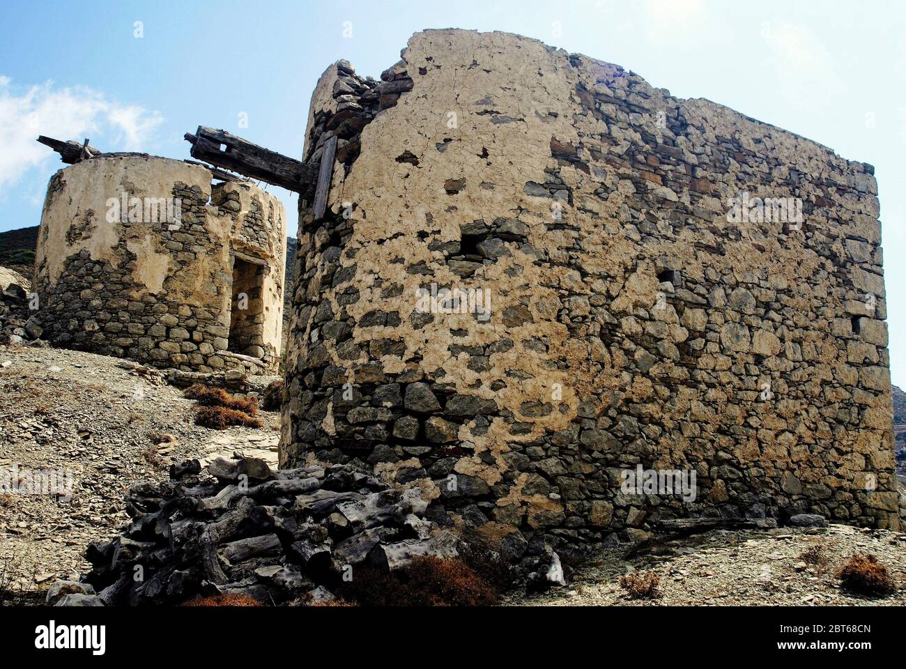 Ruins of old traditional windmills at Olympos village in Karpathos island, Greece. Stock Photo