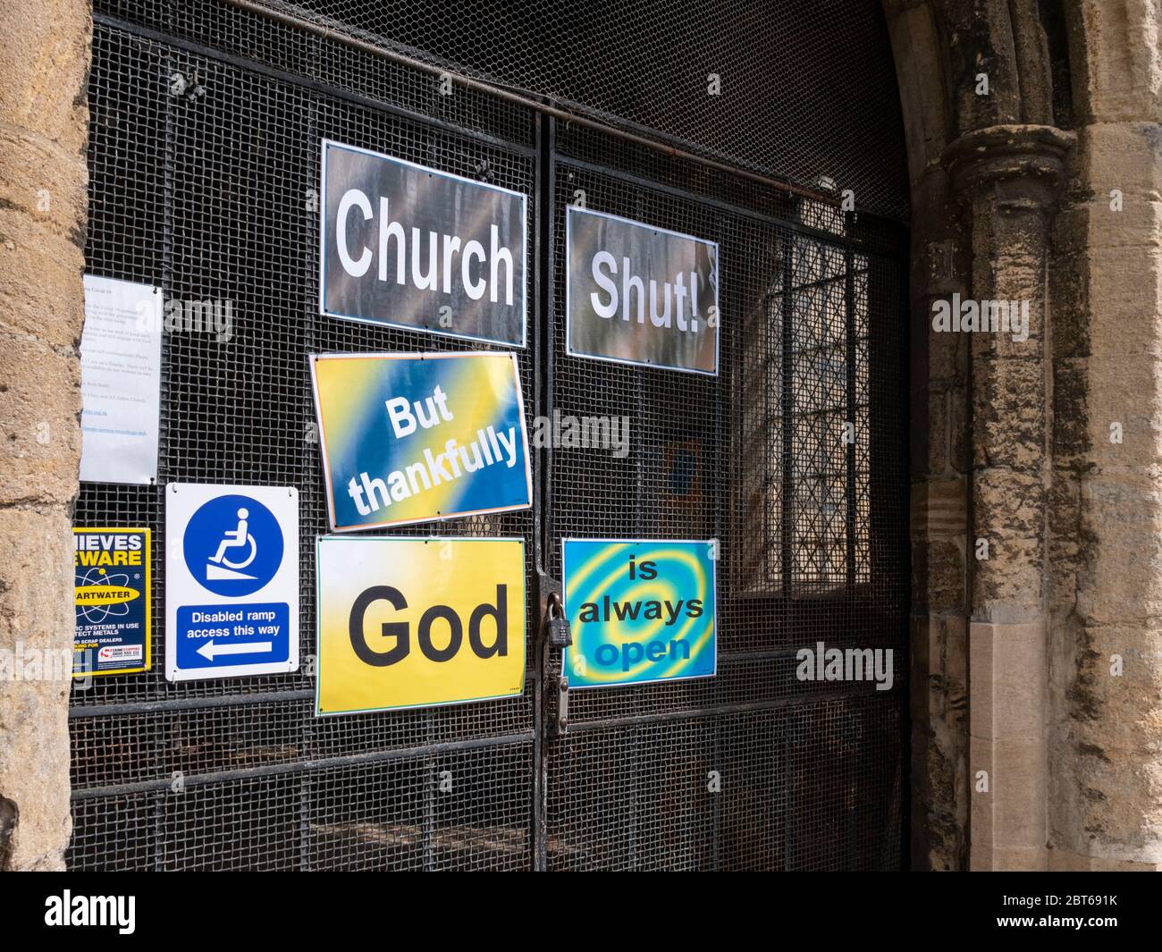 Willingham Cambridgeshire, UK. 23rd May, 2020. The church remains closed with signs on the shut door announcing that the church is closed but God is always open due to the coronavirus or covid-19 pandemic. President Trump has called for churches in USA to be reopened and they remain closed in the UK. Credit: Julian Eales/Alamy Live News Stock Photo
