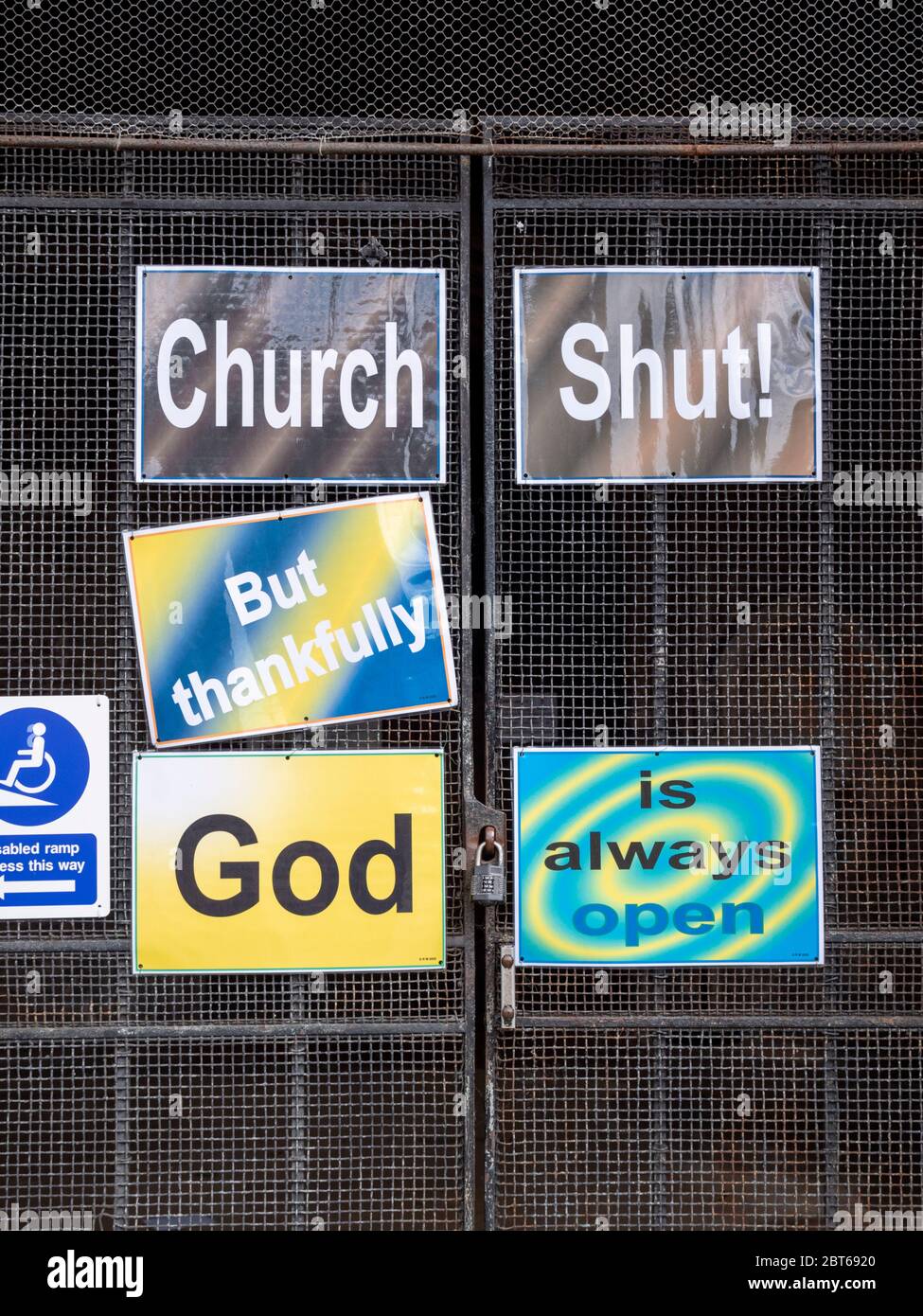 Willingham Cambridgeshire, UK. 23rd May, 2020. The church remains closed with signs on the shut door announcing that the church is closed but God is always open due to the coronavirus or covid-19 pandemic. President Trump has called for churches in USA to be reopened and they remain closed in the UK. Credit: Julian Eales/Alamy Live News Stock Photo