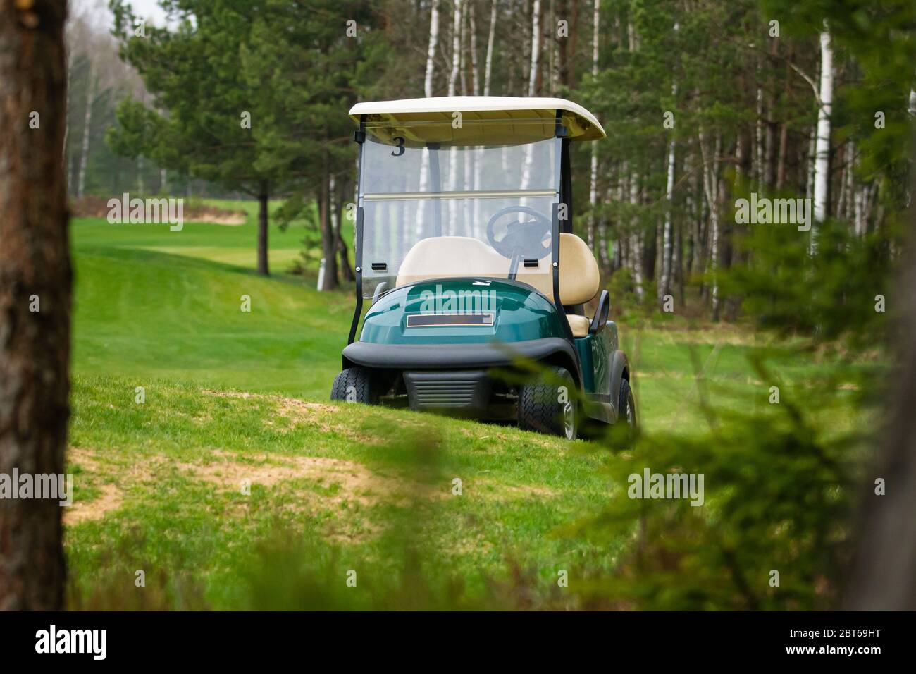 The golf car in the field Stock Photo
