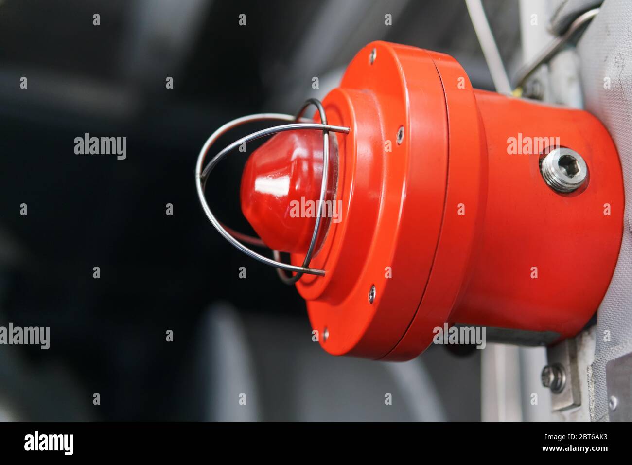 Red warning light of an emergency beacon at an industrial facility. A