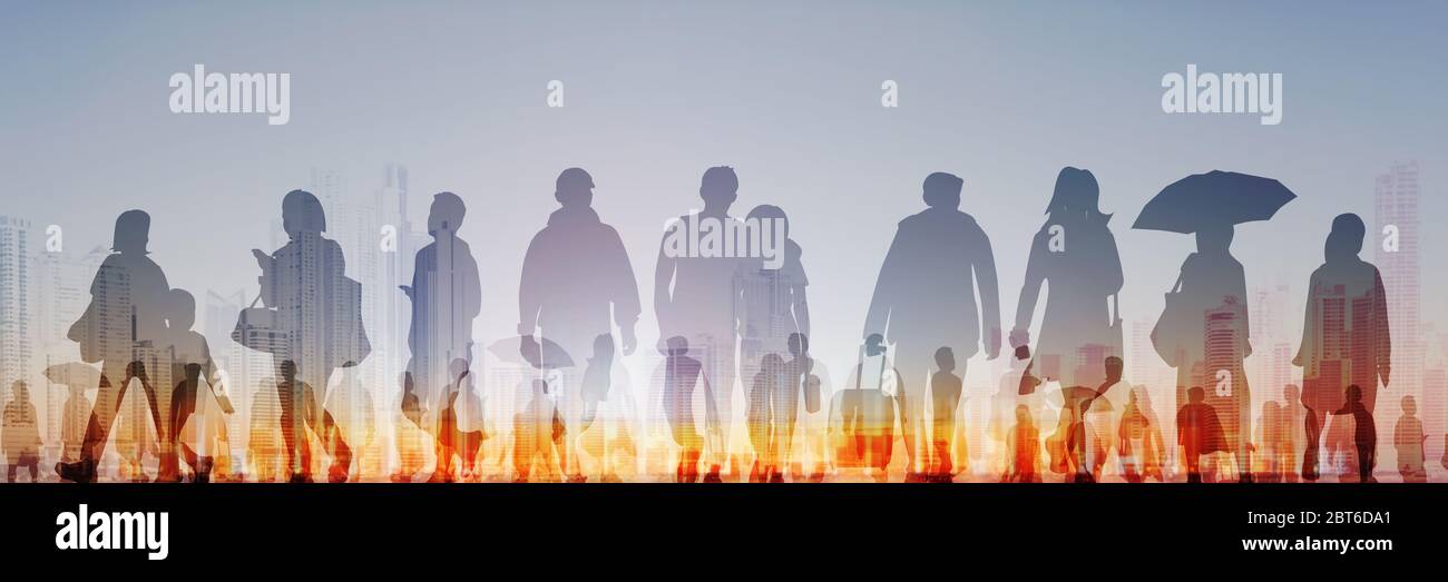 sihouette of group of people sunset sky background Stock Photo