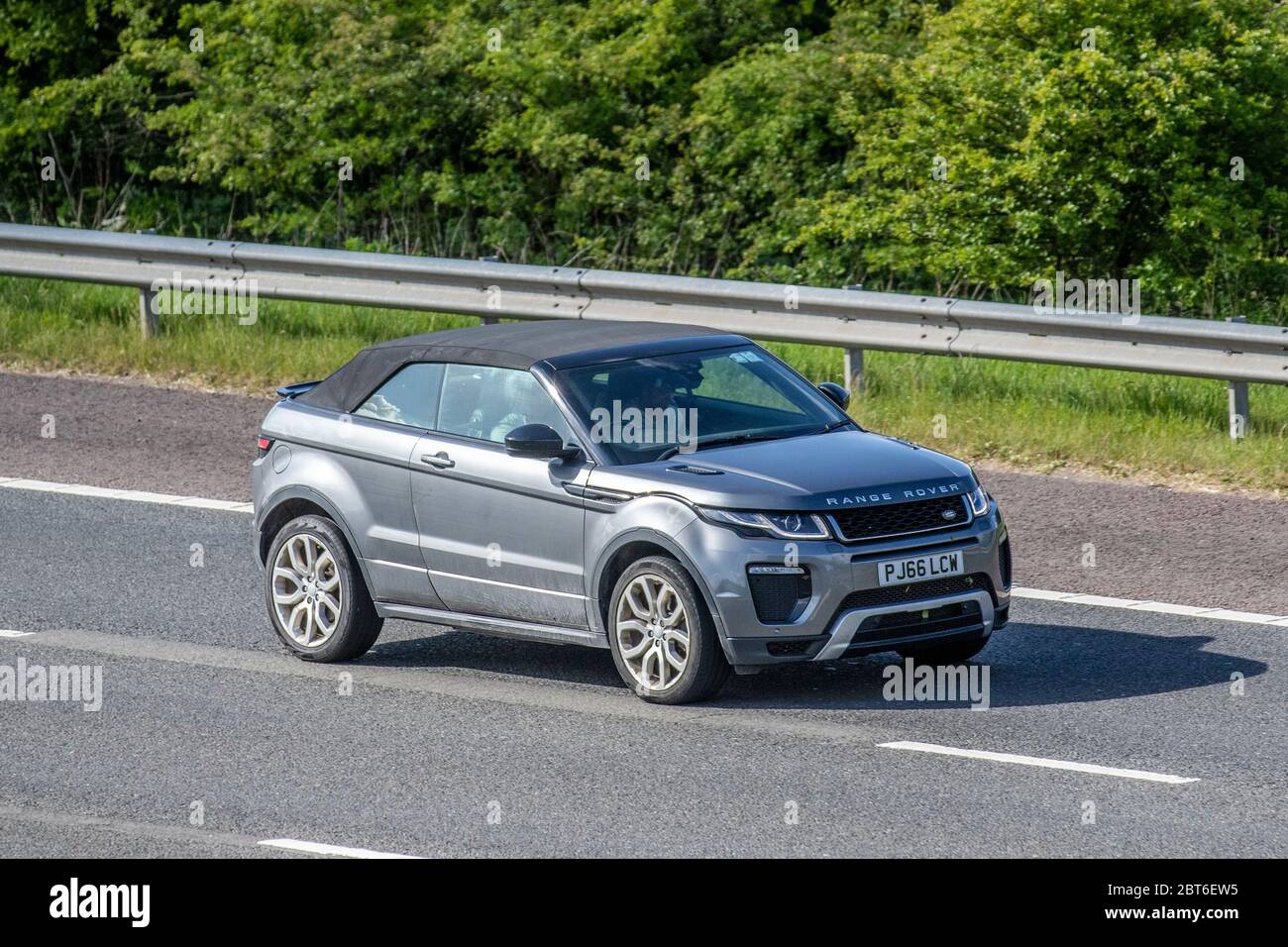 2016 grey Land Rover R Rover Evoque HSE DYN TD; Vehicular traffic moving vehicles, cars driving vehicle on UK roads, motors, motoring on the M61 motorway highway Stock Photo