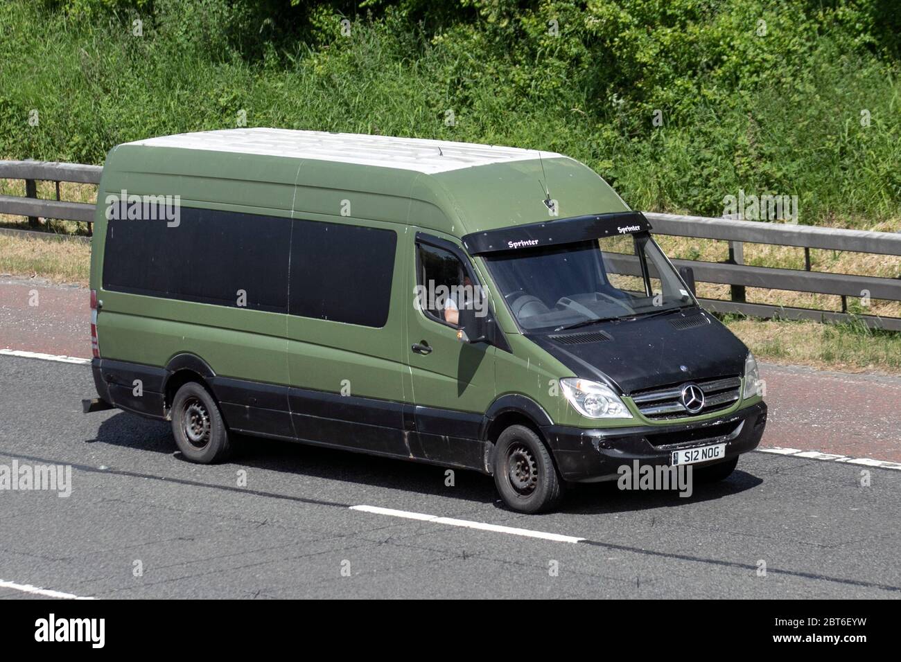 2007 green black Mercedes Sprinter 311 CDI LWB; Vehicular traffic moving  vehicles, cars driving vehicle on UK roads, motors, motoring on the M61  motorway highway Stock Photo - Alamy