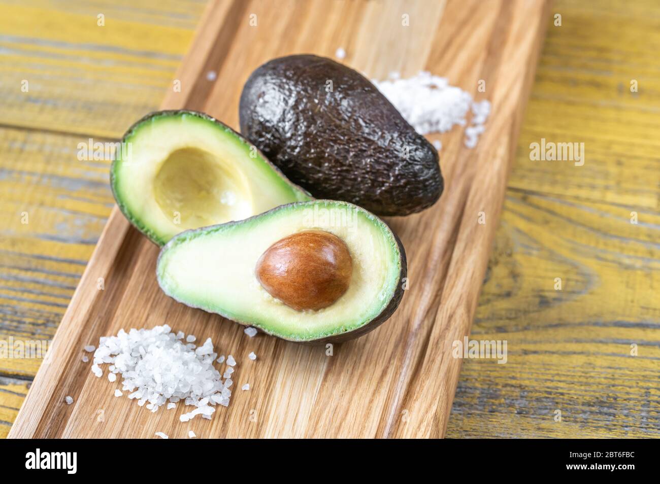 Fresh avocado on the wooden board Stock Photo - Alamy
