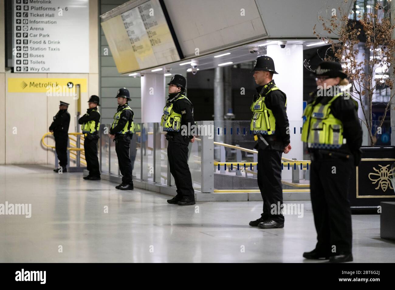 Manchester, UK. 22nd May, 2020. Police officers stand in line at Manchester Victoria Railway Station as the Manchester Arena BombÕs 3rd Anniversary is marked with a minuteÕs silence, Manchester, UK. Credit: Jon Super/Alamy Live News. Stock Photo