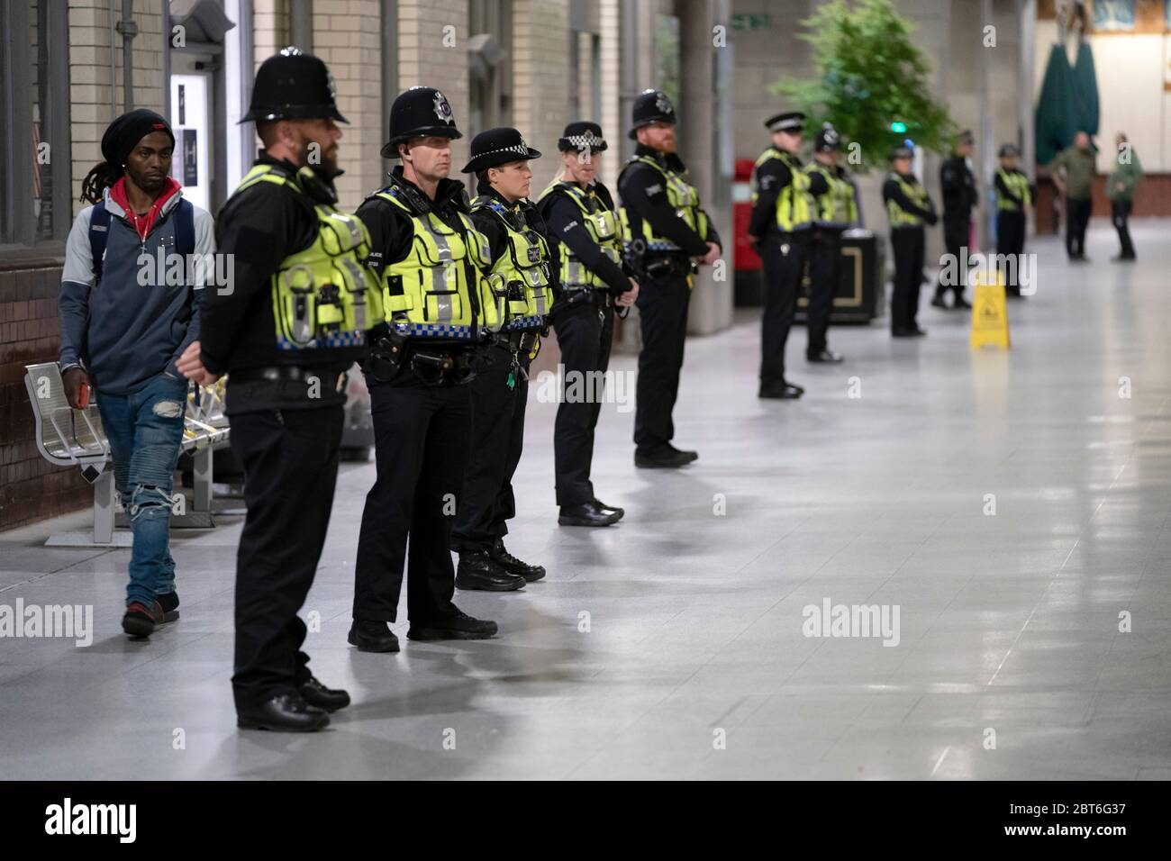 Manchester, UK. 22nd May, 2020. Police officers stand in line at at Manchester Victoria Railway Station as the Manchester Arena BombÕs 3rd Anniversary is marked with a minuteÕs silence, Manchester, UK. Credit: Jon Super/Alamy Live News. Stock Photo