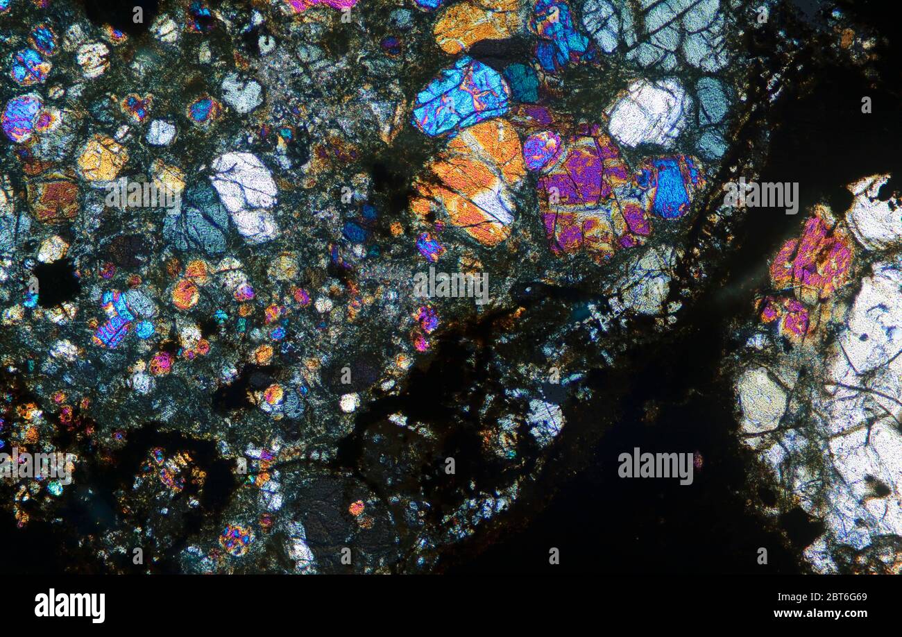 Thin section of Meteorite NWA 5736 from Western Sahara photographed in cross polarised light Stock Photo