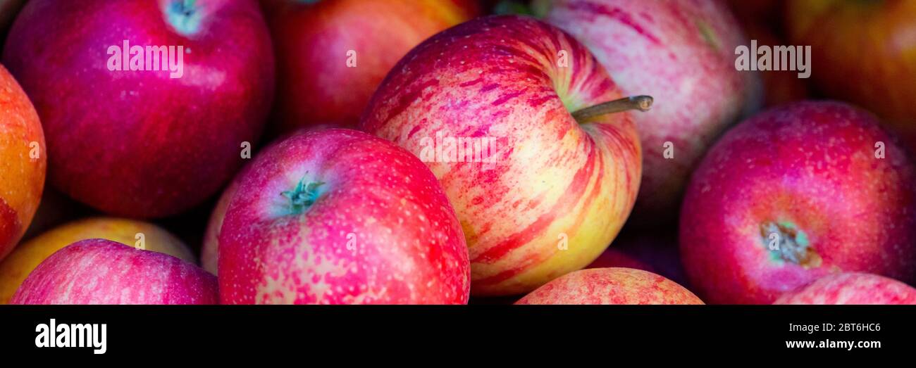 Red ripe apple background in street market Stock Photo - Alamy
