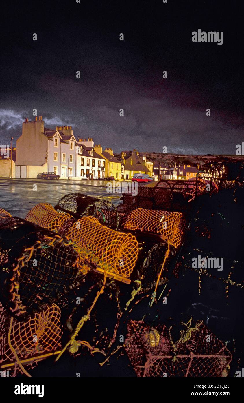 Portpatrick front with creels during Storm, Rhinns of Galloway, vert Stock Photo