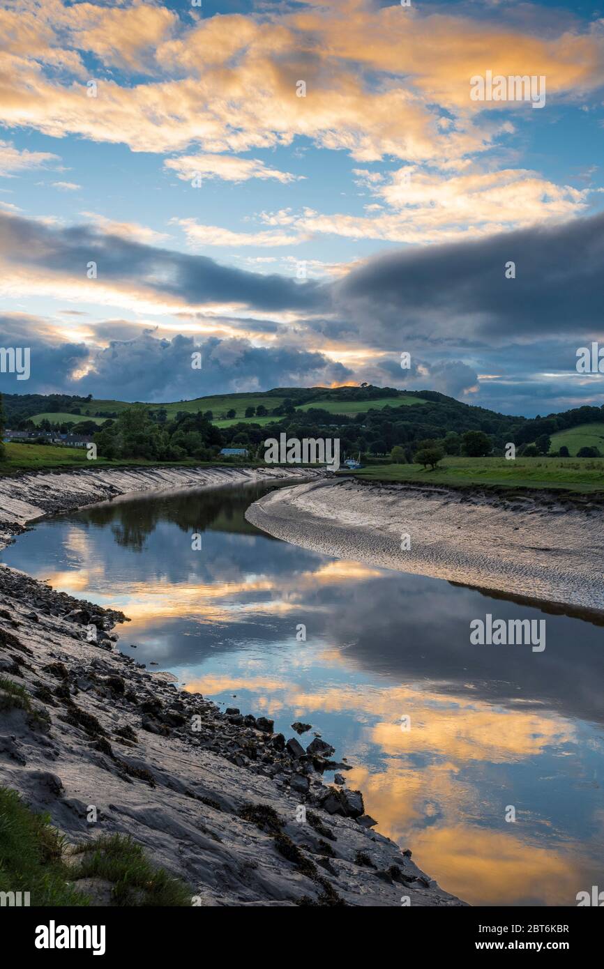 Sunset cloud patterns reflecting on the Urr estuary by Palnackie Stock Photo