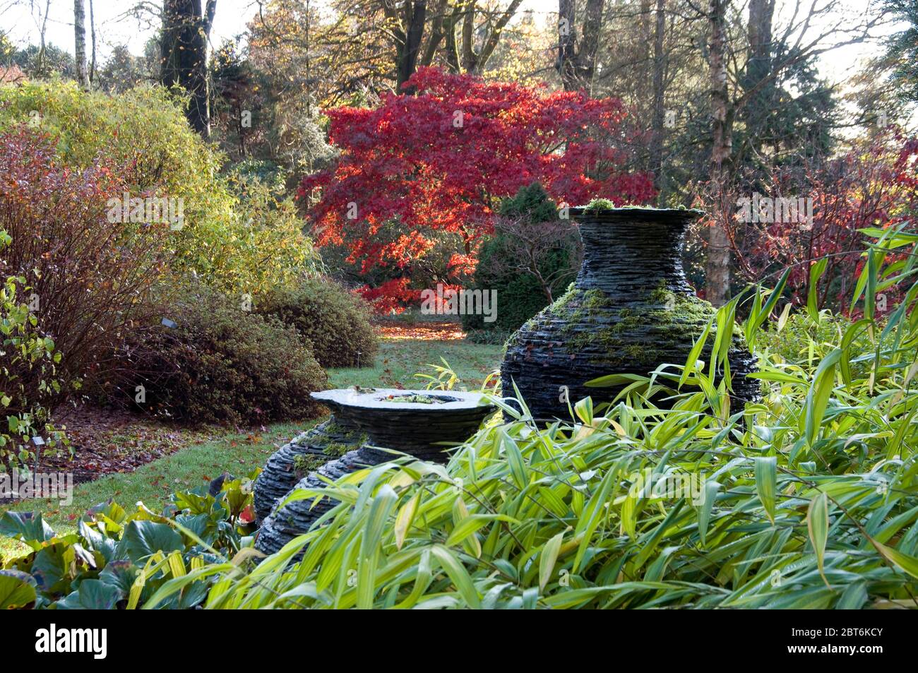 Three slate urns in Japanese garden at Threave gardens, Castle Douglas, Galloway Stock Photo
