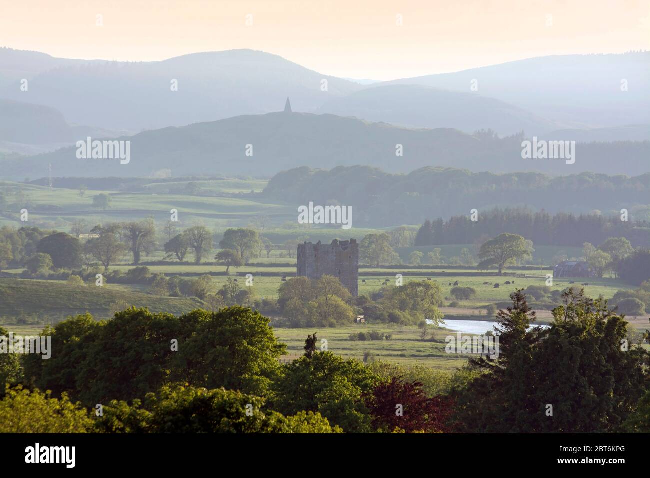 Threave Castle nestling in Dee Valley with Neilson's monument in distance Stock Photo