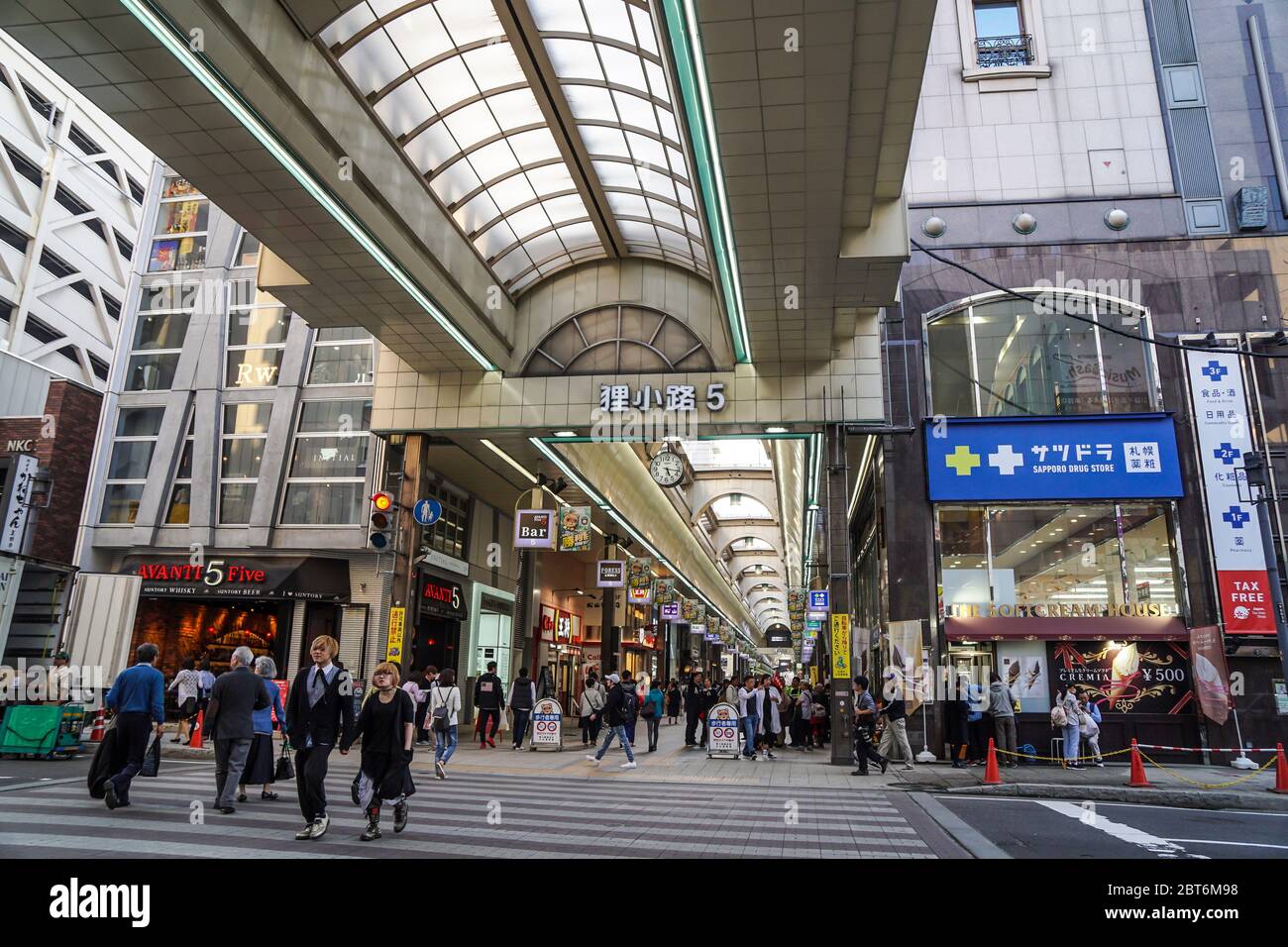 A busy district and covered shopping street in the town centre of Sapporo which is a shopping haven for tourists to Hokkaido, Japan. Stock Photo