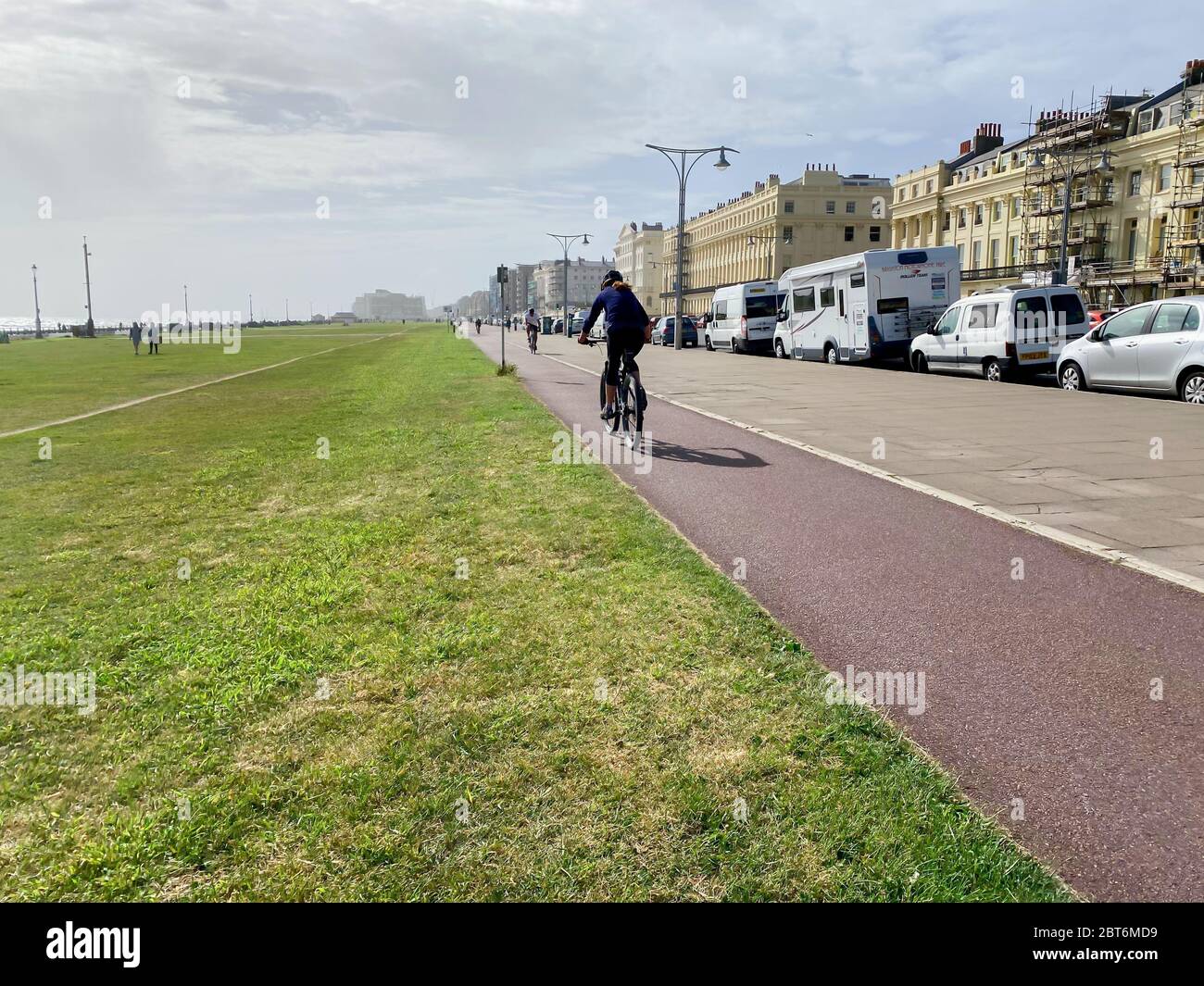 Person riding to work along a cycle path Stock Photo