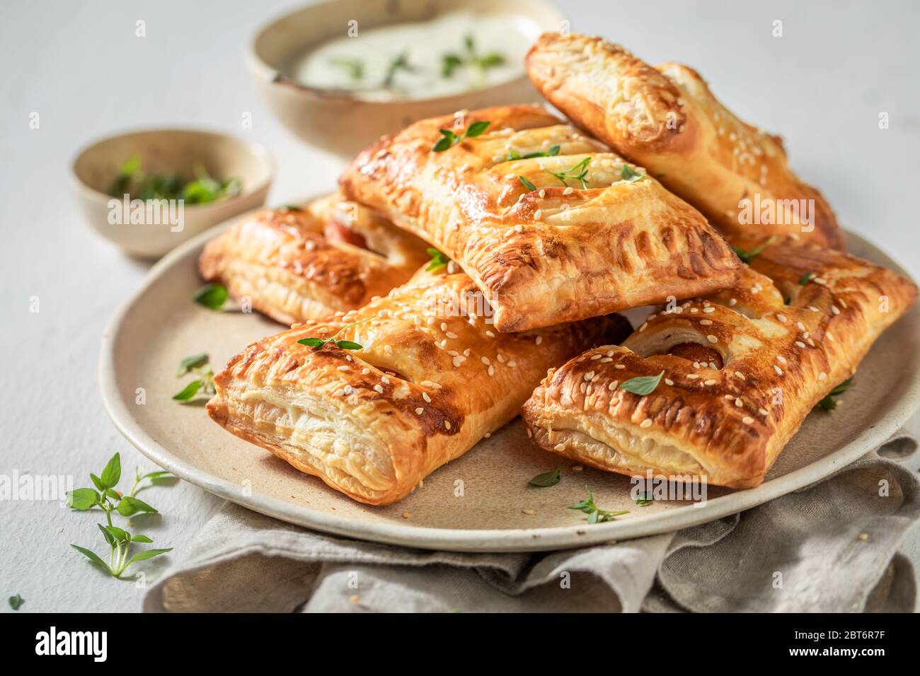 Crispy sausage roll with herbs and sesame seeds Stock Photo Alamy
