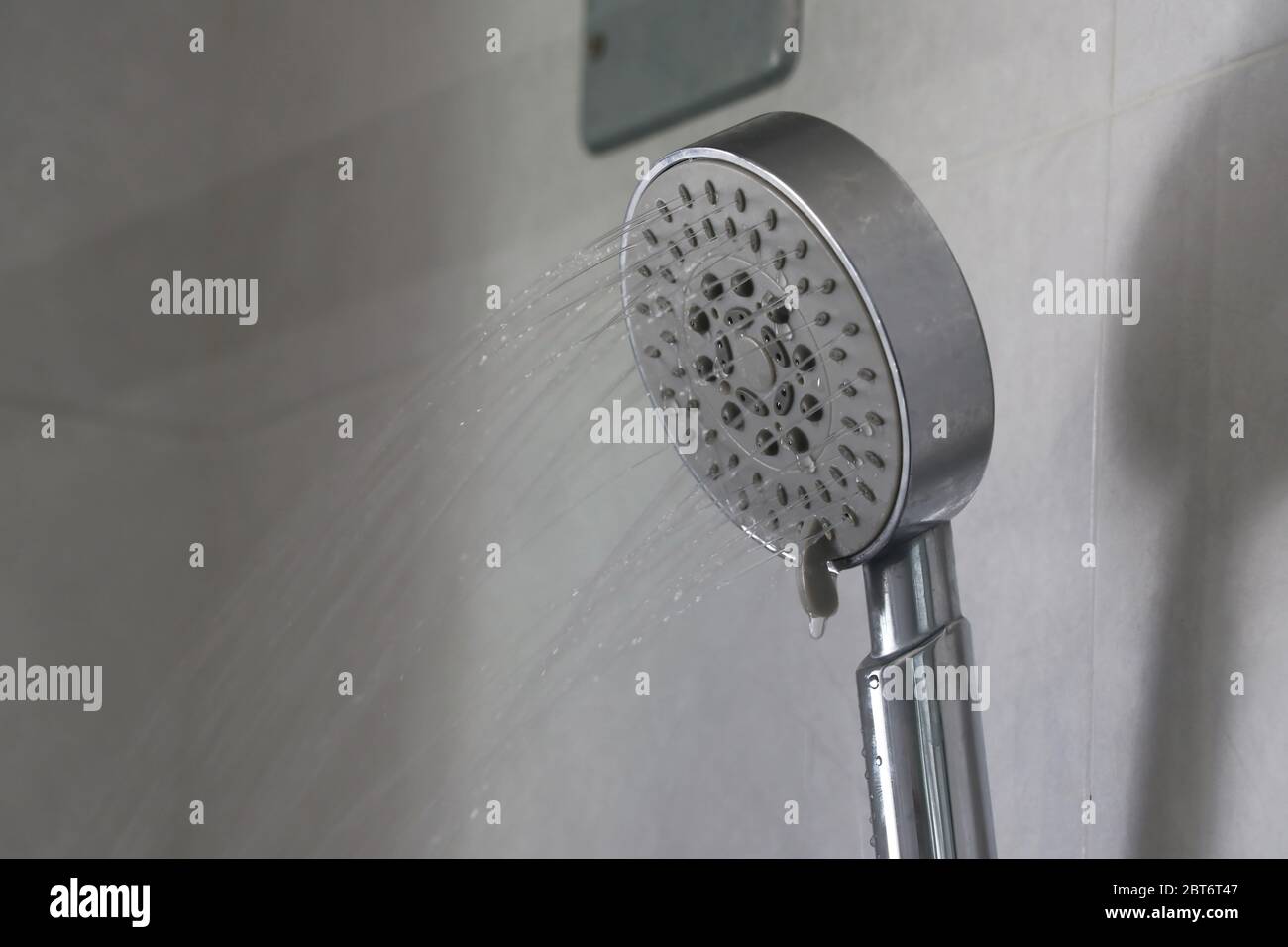 Water that flows out of the shower gently. Water flows out of the shower. Stock Photo