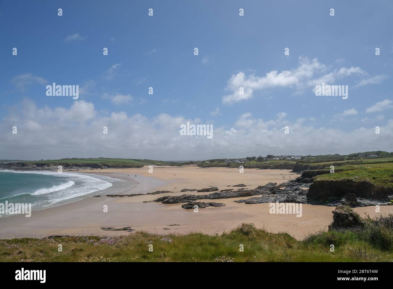 Harlyn Bay, near Padstow, Cornwall, UK. 23rd May 2020. UK Weather. The beach was relatively quiet at Harlyn Bay this afternoon, with walkers and surfers out enjoying the sunny start to the bank holiday weekend. Credit CWPIX / Alamy Live News. Stock Photo